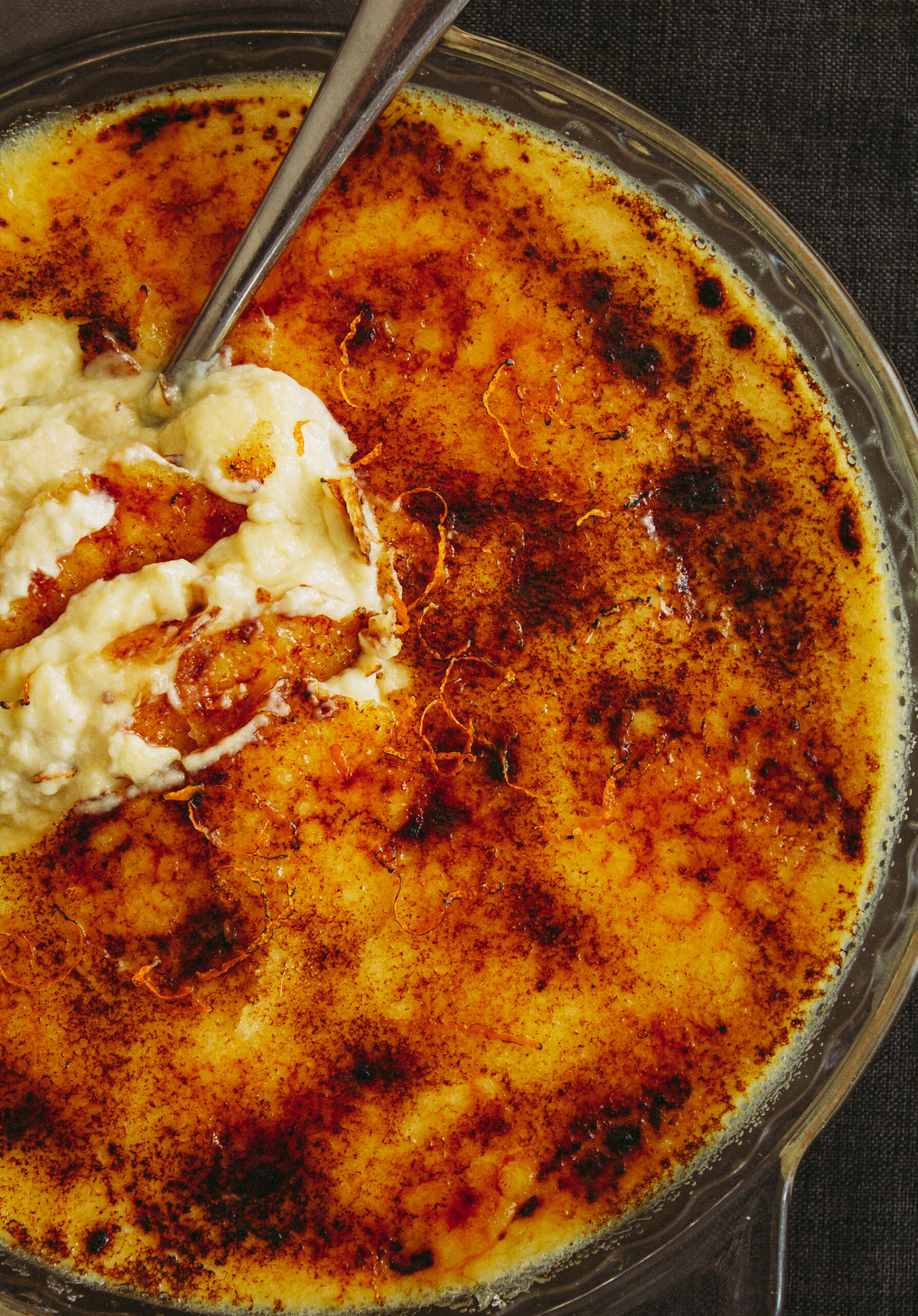 picture of a creme brulee with a spoon in it